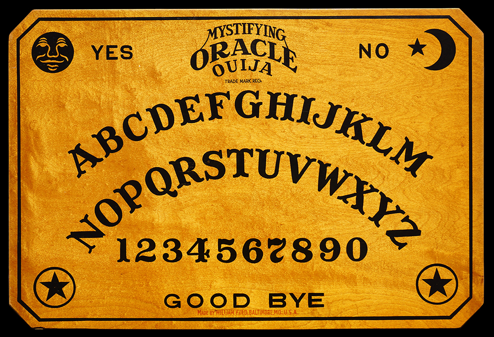 A vintage Mystifying Oracle Ouija board with the alphabet, numbers, and the words Yes, No, and Good Bye